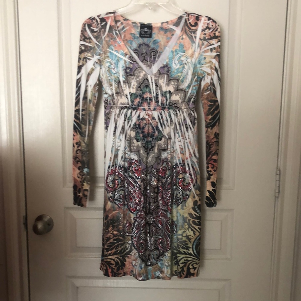 Very comfortable dress lower cut in the front 95% polyester 5% spandex